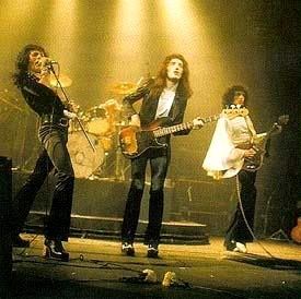 Queen performing on stage